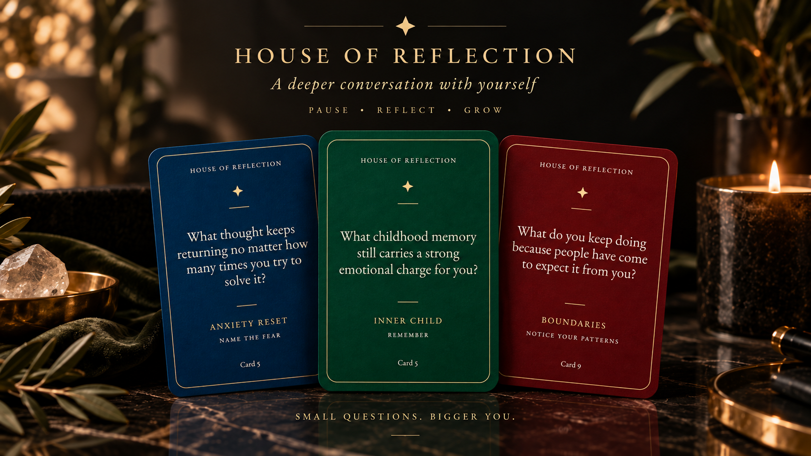 House of Reflection — three sample cards on a dark marble surface beside a candle